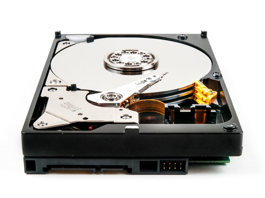 An opened hard drive showing the platter and head